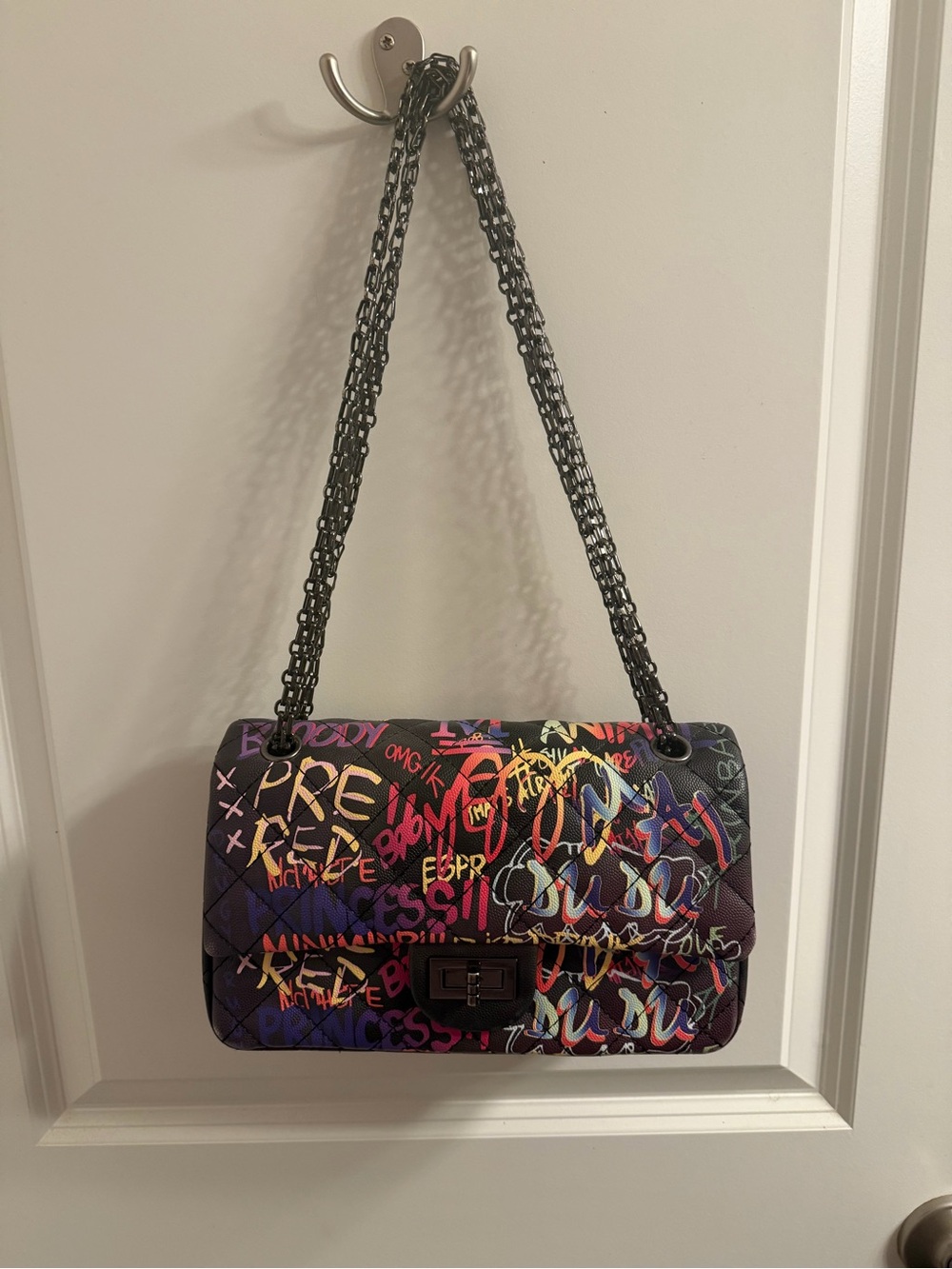 AKIRA Quilted Shoulder Bag in Black with Multicolor Graffiti